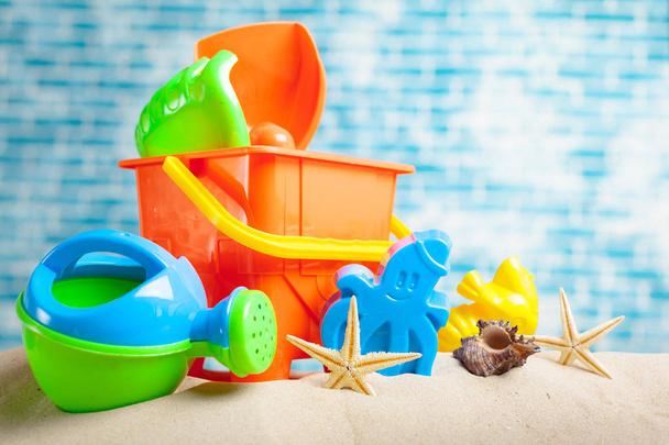 front view of childrens toys on sand - Foto, Imagen