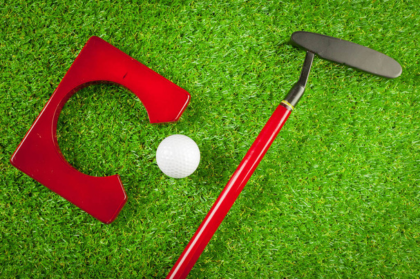 Mini golf equipment on green grass  - Фото, зображення