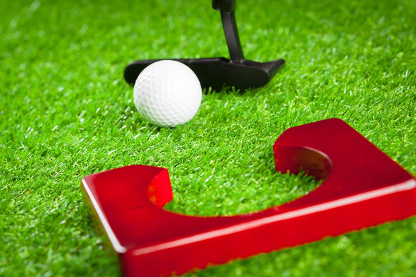 Mini golf equipment on green grass  - Zdjęcie, obraz