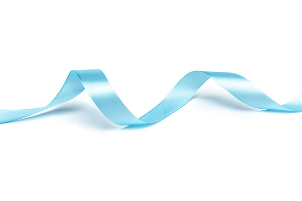 Shiny blue ribbon isolated on white background, close-up  - Foto, Imagen