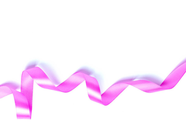 Pink ribbon isolated on white background, close-up  - Photo, image
