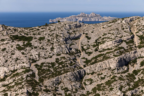 aerial view of beautiful rocky mountains, winding road and scenic sea shore in Calanques de Marseille (Massif des Calanques), provence, france - 写真・画像