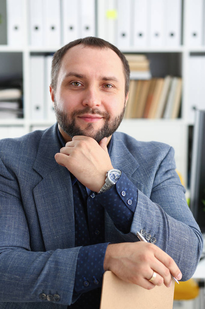 portrait of young handsome promising businessman in office - Фото, изображение