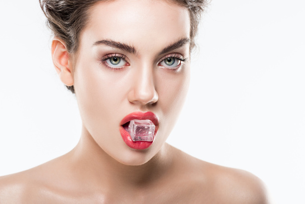 beautiful woman holding ice cube in lips, isolated on white - Foto, Bild