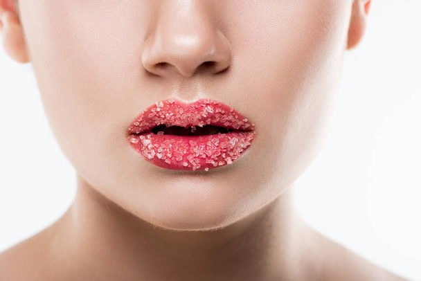partial view of girl with sweet sugar on lips, isolated on white - 写真・画像