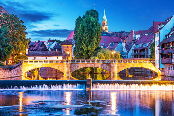 Scenic summer night view of the bridge over Pegnitz River in the Old Town of Nurnberg, Bavaria, Germany - Photo, Image