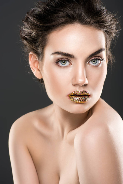 attractive naked woman with golden lips, isolated on grey - Fotoğraf, Görsel