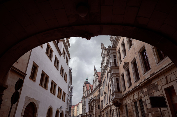 arch and street with old historical buildings in Dresden, Germany - Zdjęcie, obraz