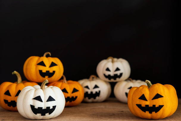 White and yellow ghost pumpkin on black background. halloween concept. - Fotoğraf, Görsel