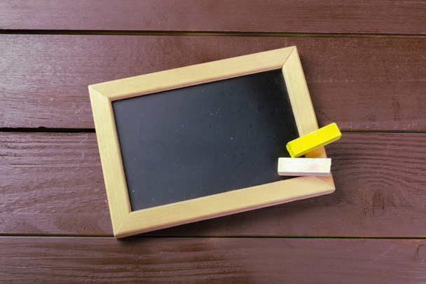 top view of Small wooden framed blank blackboard  - Fotó, kép