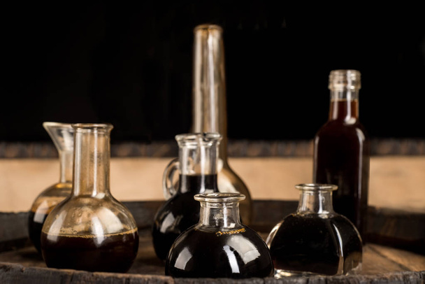 Old barrel and bottles for  balsamic vinegar in modena  - Φωτογραφία, εικόνα