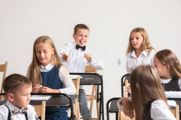 School children in classroom at lesson - Foto, afbeelding