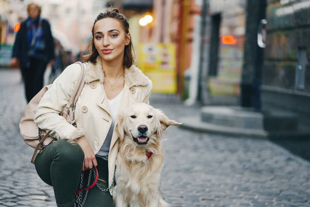 girl walking dog in the city - Valokuva, kuva