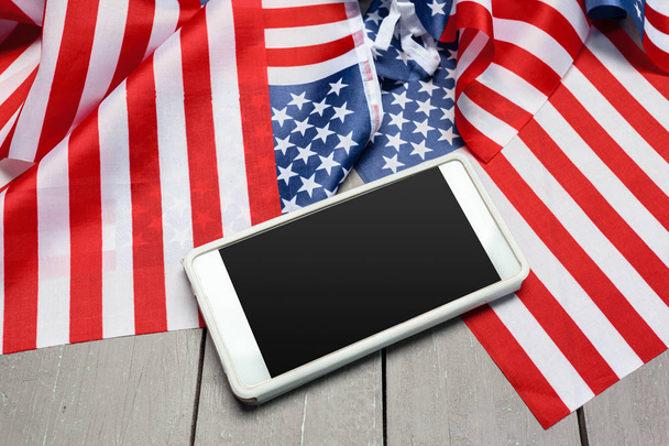 Us flag and smartphone - 写真・画像