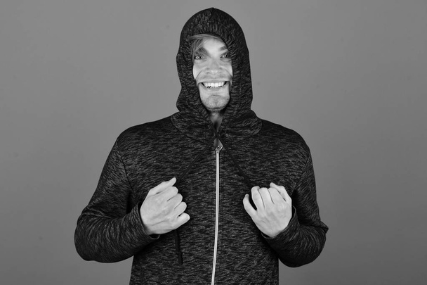 Guy with bristle in dark grey and black hoodie - Фото, зображення
