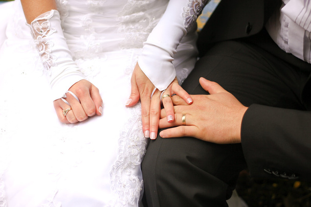 Bride and groom holding hands - Photo, Image
