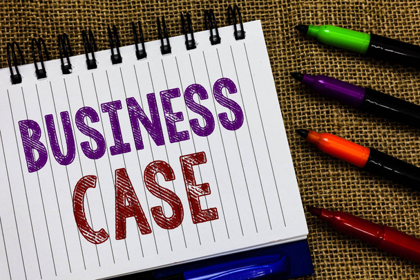 Text sign showing Business Case. Conceptual photo Proposition Undertaking Verbal Presentation New Task Open spiral notebook page jute background colorful markers Expressing ideas. - Photo, Image