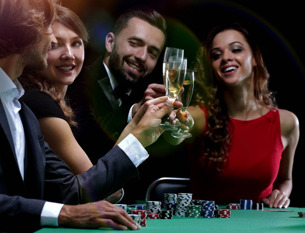 friends drinking and celebrating a gambling night - Фото, зображення