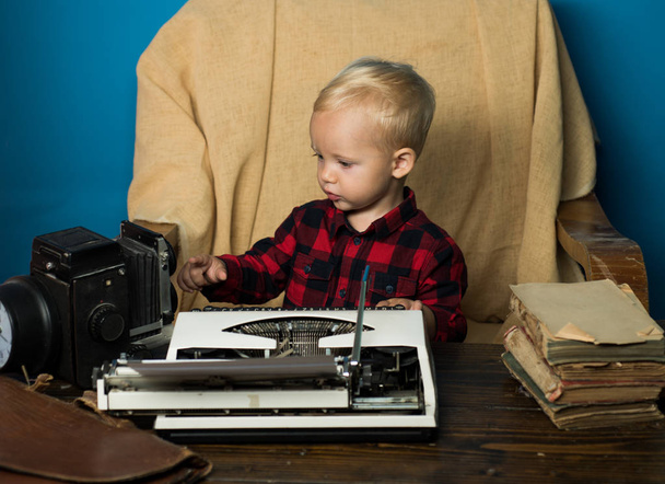 Little journalist work with vintage typewriter and camera at desk. Because I am a journalist - Foto, Imagem