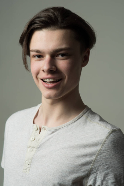 Teenage concept. Happy teenage boy. Teenager enjoy teenage time. Teenage model with candid smile - Foto, Bild