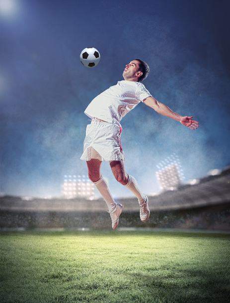 football player striking the ball - Valokuva, kuva