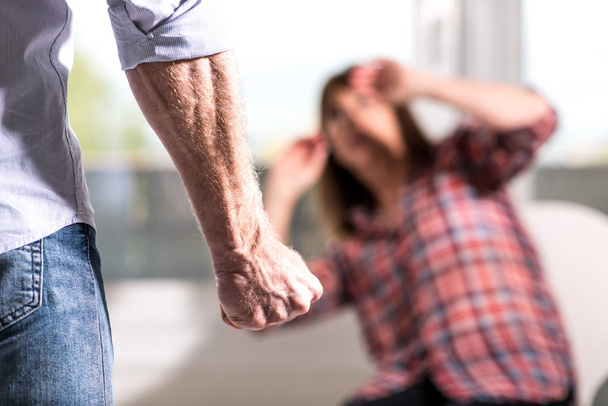 Man about to beat up his wife at home - Photo, Image