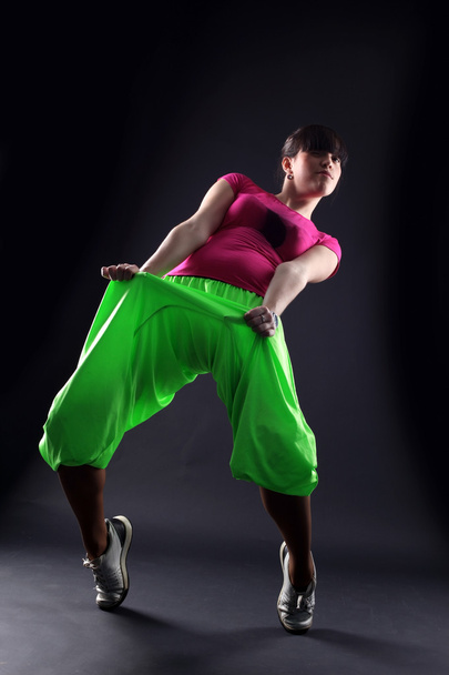 Cool woman modern dancer against black - Zdjęcie, obraz
