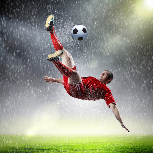 football player striking the ball - Fotó, kép