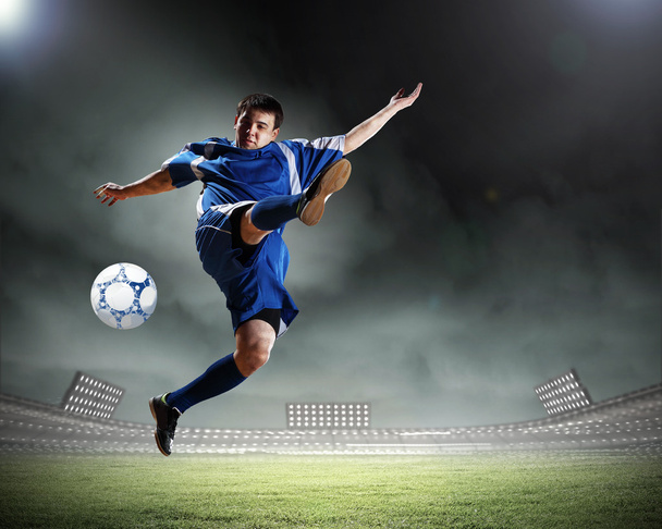 football player striking the ball - Фото, зображення