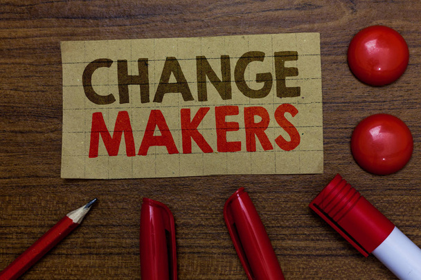 Handwriting text writing Change Makers. Concept meaning Young Turk Influencers Acitivists Urbanization Fashion Gen X Paperboard markers pencil wooden background communicating ideas red balls. - Photo, Image