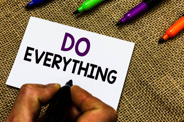 Writing note showing Do Everything. Business photo showcasing Jack of All Trades Self Esteem Ego Pride No Limits Man hand holding marker white paper communicating idea Jute background. - Photo, Image