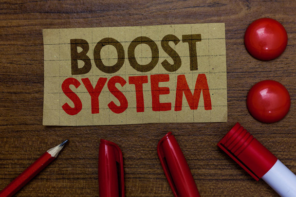 Handwriting text writing Boost System. Concept meaning Rejuvenate Upgrade Strengthen Be Healthier Holistic approach Paperboard markers pencil wooden background communicating ideas red balls. - Foto, afbeelding