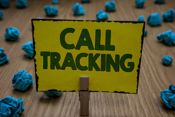 Text sign showing Call Tracking. Conceptual photo Organic search engine Digital advertising Conversion indicator Clothespin holding yellow paper note crumpled papers several tries mistakes. - Photo, Image
