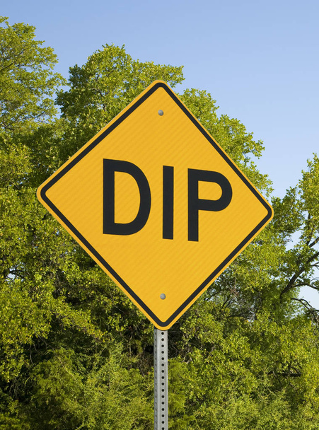 Dip Sign Against Green Trees And Blue Sky, Vertical Format - Photo, Image