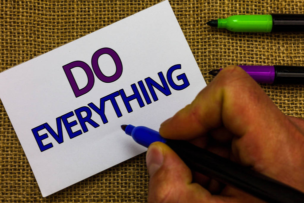 Text sign showing Do Everything. Conceptual photo Jack of All Trades Self Esteem Ego Pride No Limits Man hand holding marker white paper communicating ideas Jute background. - Photo, Image