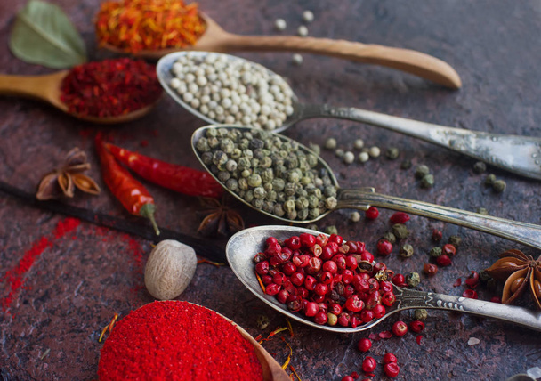 various spices in spoons and on table, close up - Foto, Imagen