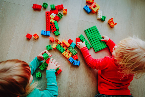 kids play with colorful plastic blocks, education - Photo, Image