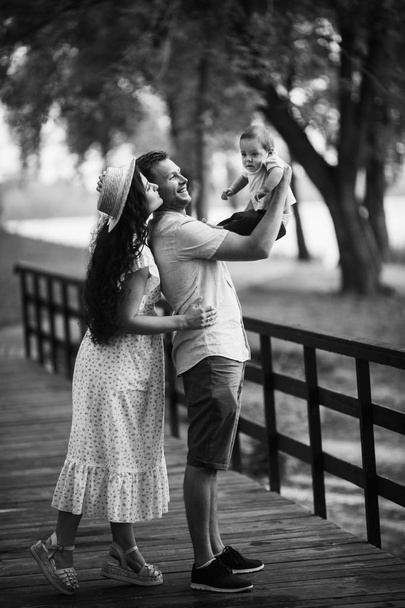 Happy young family with small son in the park - Fotografie, Obrázek