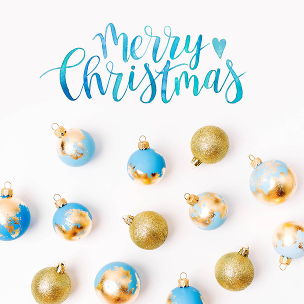 blue and golden christmas baubles isolated on white background - Foto, afbeelding