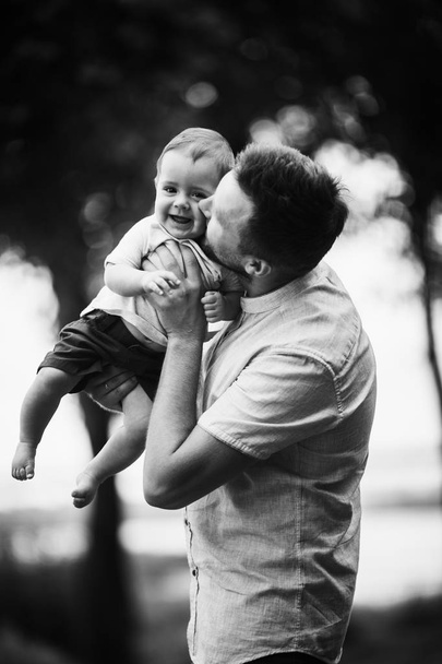 Happy young father  with son in the park - Fotó, kép