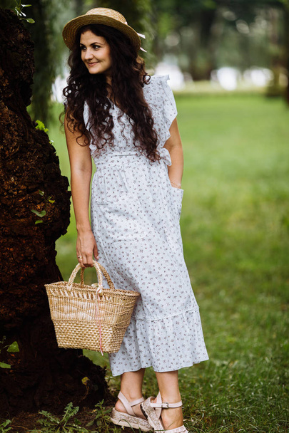 Beautiful young  woman  in summer park  - Фото, зображення