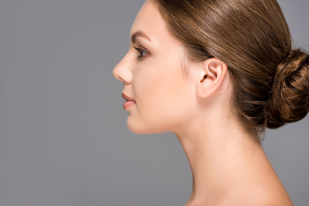 side view of beautiful woman with perfect skin isolated on grey - Valokuva, kuva
