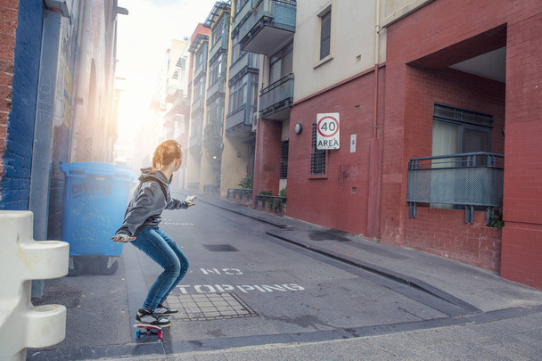 Teenager girl ride her skateboard. Mixed media - Foto, imagen