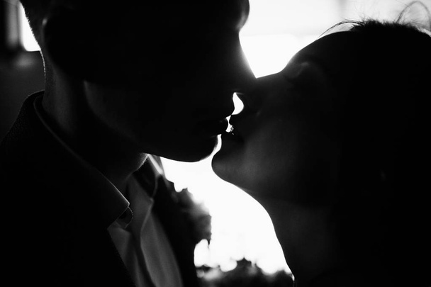happy couple of young  newlyweds kissing - 写真・画像