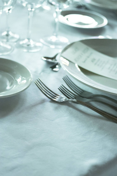 Wedding reception banquet dinner party table place settings set in luxury hotel venue. - Fotografie, Obrázek