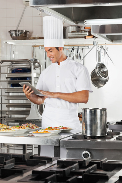 Happy Chef Using Digital Tablet In Kitchen - Zdjęcie, obraz