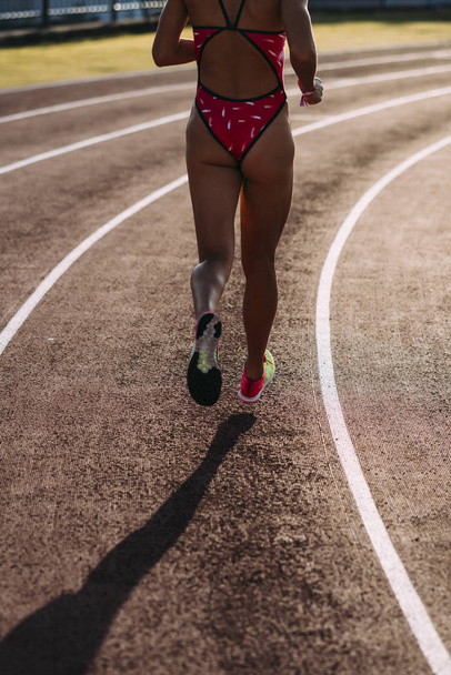 Close-up of the legs of a runner woman - Fotoğraf, Görsel