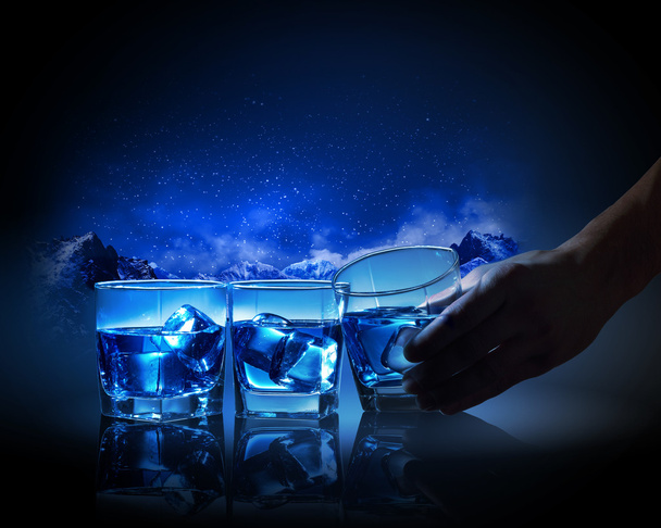 Three glasses of blue liquid with ice - Foto, immagini
