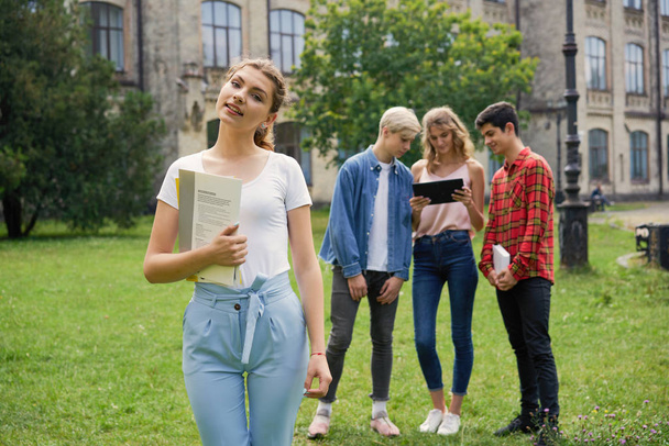  College students    with books at the school courtyard - Foto, immagini
