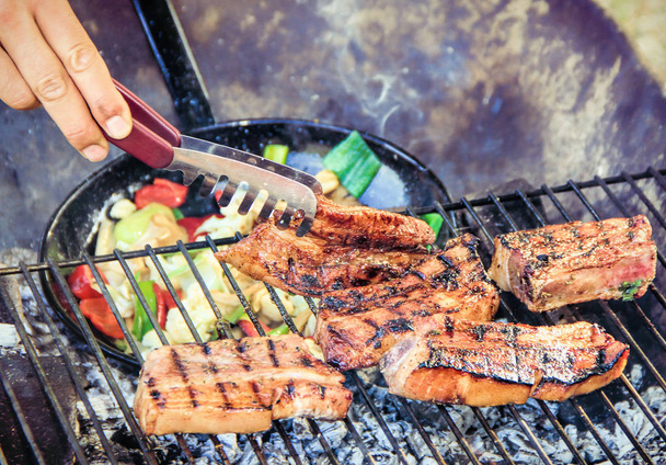 spare ribs and vegetable grill pan on a grill - Photo, Image